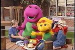 Barney, BJ, and the children play with hats.