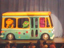 Barney, Baby Bop and BJ in the bus.