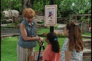 Miss Jo beside a missing poster for Cody