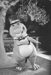 Another B&W promotional photo of Barney wearing a bow-tie and a top hat, doing another pose.