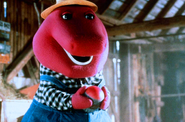 Barney holds Twinken's egg inside one of the barns