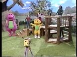 Barney, BJ, and the children exercise in front of the camera.