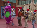 Barney and the children pretending to be in a band.