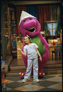 Barney and Angela wearing triangle hats