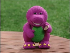 The Barney doll holds a cookie while winking at the viewer at the end of this episode, "Tea-riffic Manners"