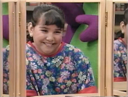Tina looking at herself in the mirror