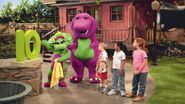 Barney, Baby Bop, and the children beside the number 10