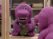 The Barney doll looking at itself in the mirror