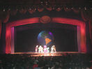 Everyone hugging each other onstage.