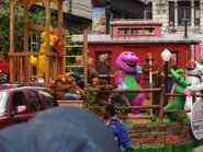 Barney, BJ and Baby Bop on Barney's Musical Playground float alongside the Polar Bear from Barney's Colorful World!.