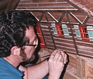 Jess Nelson working on the model of Santa's workshop from Waiting for Santa