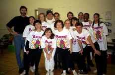 Director, Bruce Deck (far left) and choreographer Penny Wilson (front center) with the cast who played the marching band.