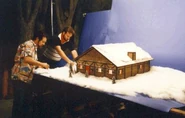 Jess Nelson and Ray Henry working on the model of Santa's workshop from Waiting for Santa