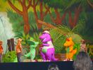 Barney, Baby Bop, BJ and the children in the jungle.