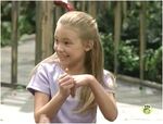 Sarah sitting on the playground.
