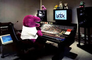 Barney, BJ, Baby Bop and Wishbone plushies at Lyrick Studios' control room for a recording session.