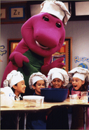 Barney and the children watch the bread rise.