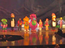 Everyone with the penguins singing "The Rainbow Song".