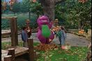 Barney and the children playing in the fall leaves (from the episode "Tree-Mendous Trees").