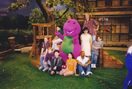 Barney with the original cast members of Barney & Friends on the school set during a mini reunion.