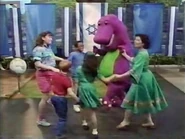 Barney & the kids dance to the song