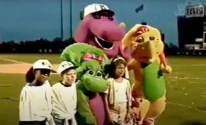 Barney, Baby Bop, BJ, Shawn, and Tosha with a fan at Shea Stadium