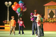 The Balloon Man and the kids with the Barney doll.