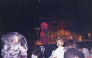 Barney appears on stage.