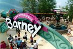 The arch logo for A Day in the Park with Barney welcomes fans of all ages