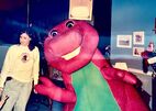 Barney standing right next to the choreographer, Penny Wilson