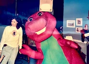 Barney standing right next to the choreographer, Penny Wilson