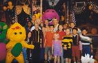 A group photo of the cast of Sing & Dance With Barney.