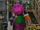 Barney and the children hugging.