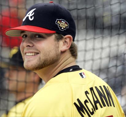 Braves catcher Brian McCann enjoys family time with his 1-year old