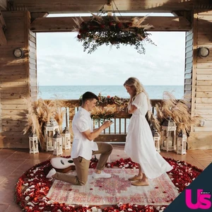 Travis proposing to Katie.