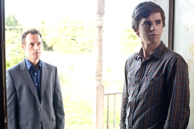 Norman (Freddie Highmore) answers the door and is surprised to find a handsome man (Michael Vartan) waiting to take his mother to dinner.