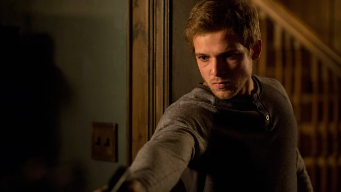 Dylan moves in for the kill, ready to end things once and for all. He takes aim at Shelby and pulls the trigger, but he's out of ammo. He scurries up the stairs to reload as Shelby recovers his piece and stalks slowly up the stairs behind him.