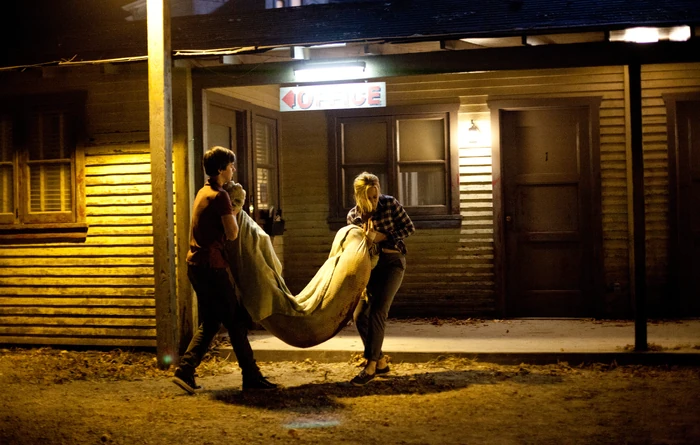Norman and Norma haul Summers' body into one of the rooms. On the way in, they drop him, leaving a smear of blood on the carpet. Now it will have to come up, along with the matching carpets in several other rooms.