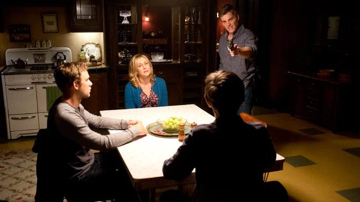 Shelby forces the family at gunpoint into the kitchen where he wrestles with what to do next. He directs his rage at Norman, saying that he loved Norma and was going to take care of them, but now everything is ruined.