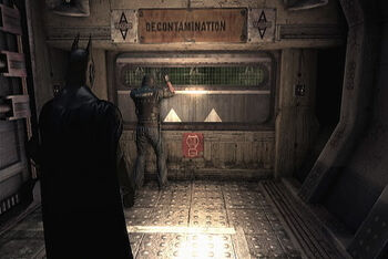 Burlow watches his friends die through an observation window in the Decontamination Chamber, but cannot help them.