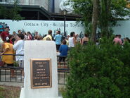 A dedication plaque in the Gotham Park area of the queue.