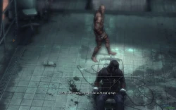 Zsasz pacing behind Mike, strapped in the electroshock chair, after taking him hostage.