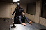 The Joker with Batman in the interrogation room