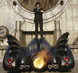 Tim Burton atop the Batmobile.