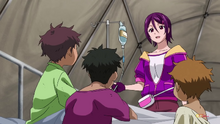 Mai treating kids in a makeshift hospital.