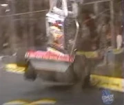 Atomic Wedgie gets slammed into the spikestrip by Maximus.