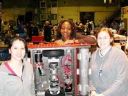 The team displaying Tulsa Hurricane's internals in The Pits.