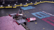 Lucky punches Mammoth's wheel off.