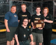 Marc DeVidts and Team UI are presented with their 120lb Collegiate winner award.