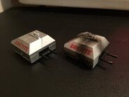 The standard toy next to its battle damaged variation.